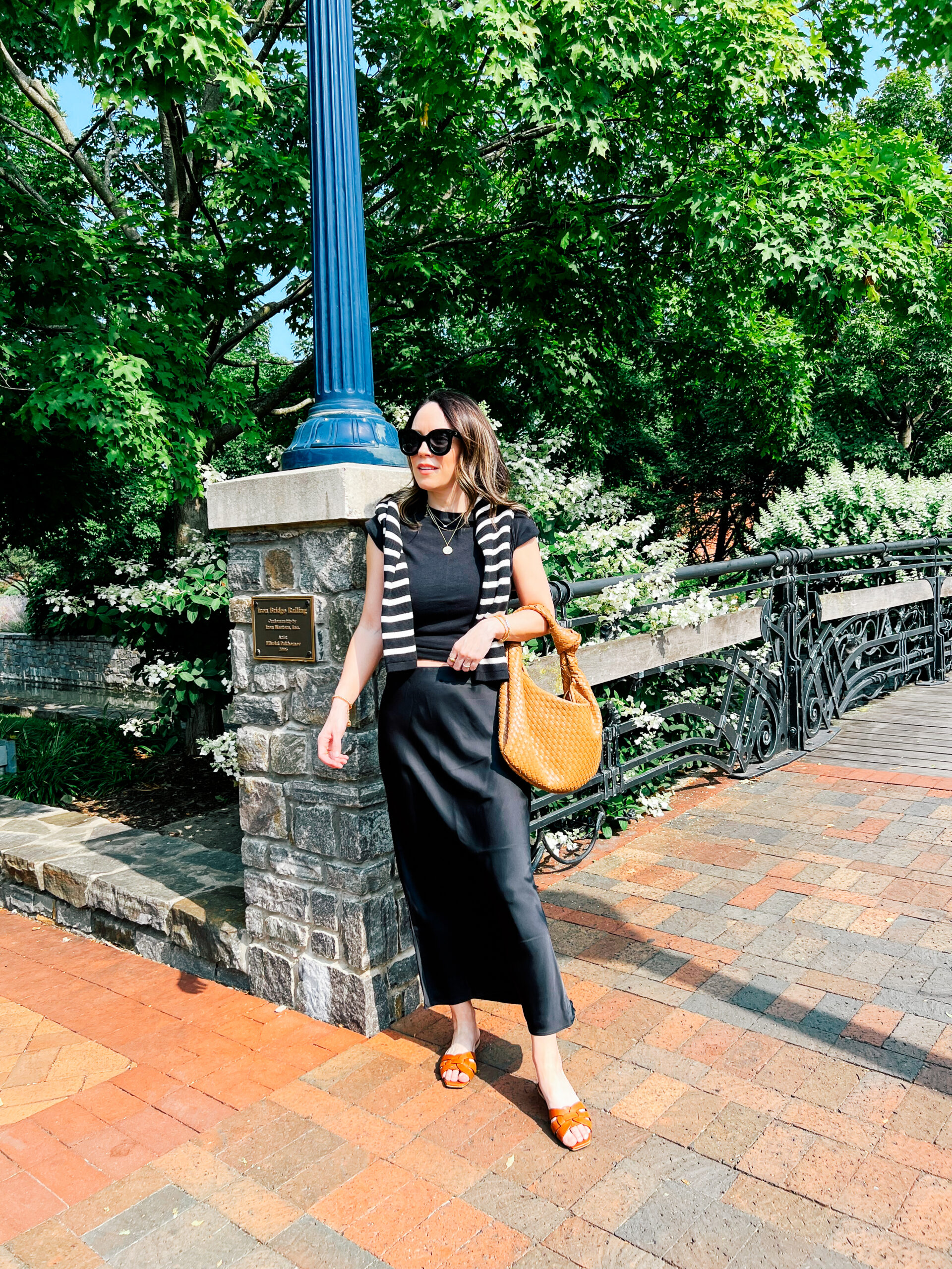 Maree Sye A Little Bit etc blogger wearing black top and skirt and striped cardigan for her Outfits I Wore - August 2023 post