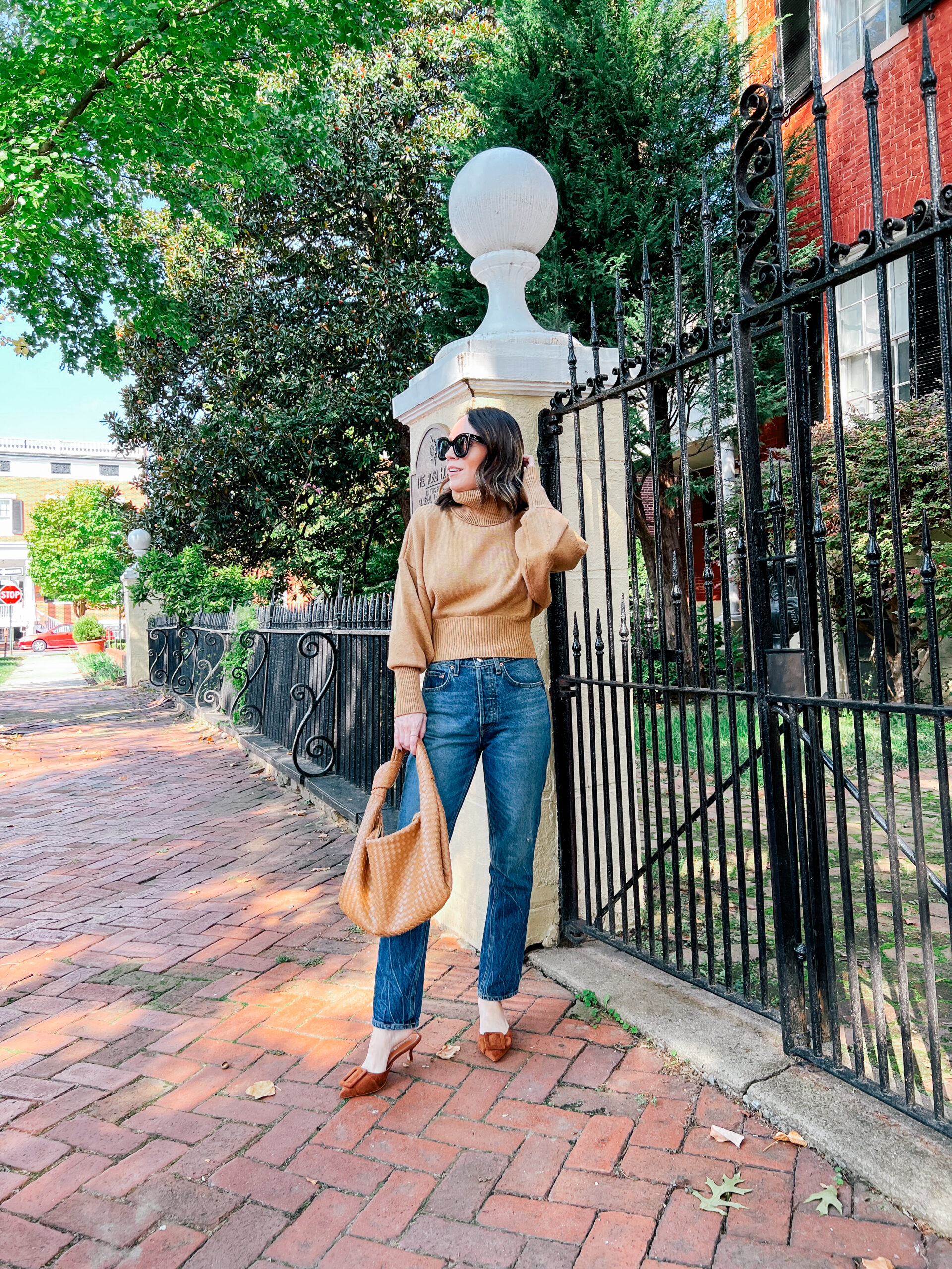 tan sweater and jeans